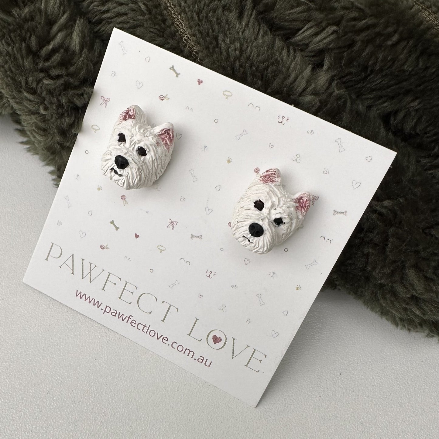 Westie Dog-shaped earrings on a 'Pawfect Love' branded card with a soft background
