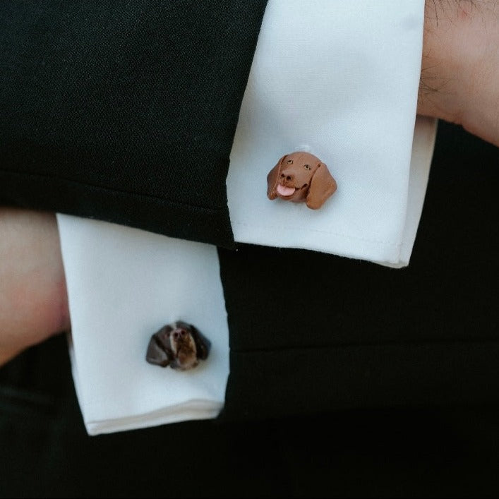 Mismatched custom dog cufflinks, representing 2 dog faces.