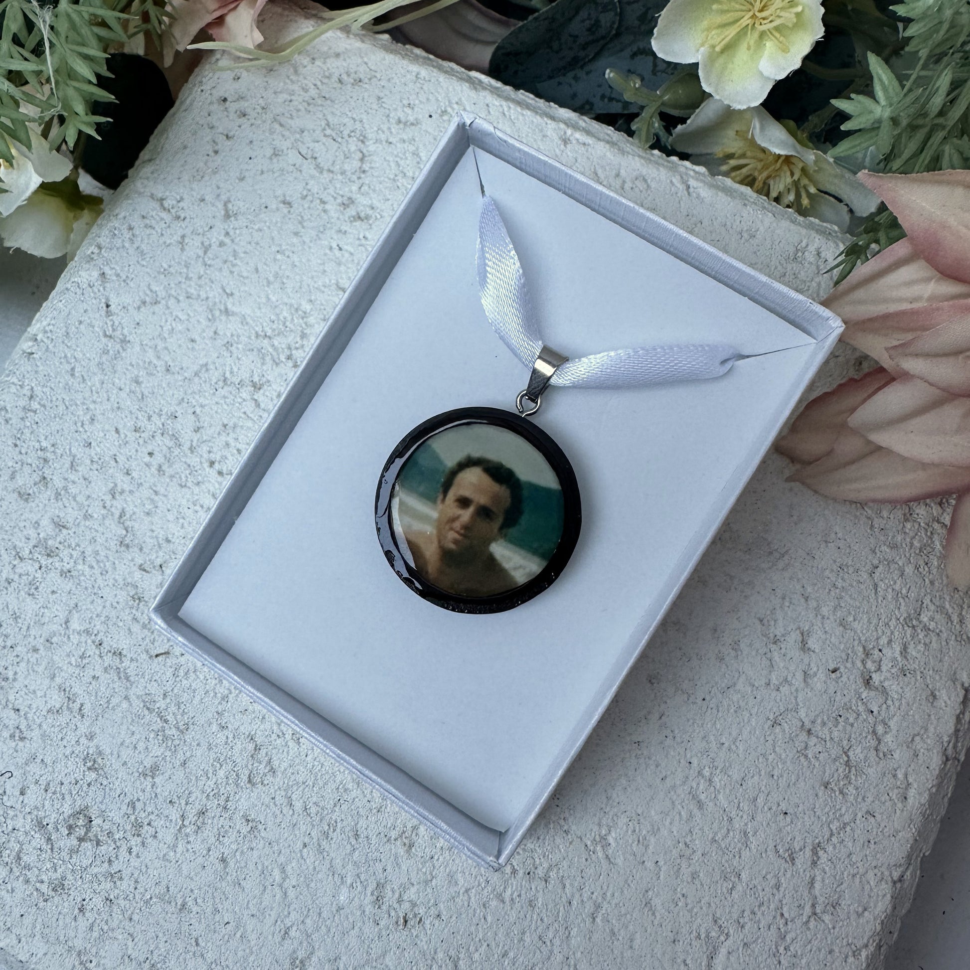 Memorial photo charm of father for bridal bouquet, pictured in white giftbox.