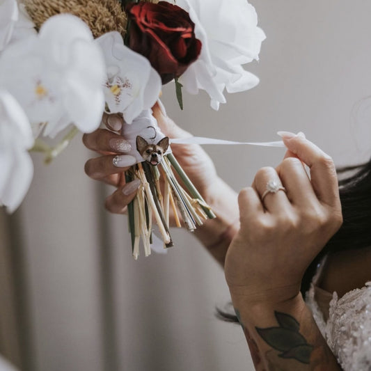 Custom pet bridal bouquet charm photo from a wedding day, featuring a chihuahua face.