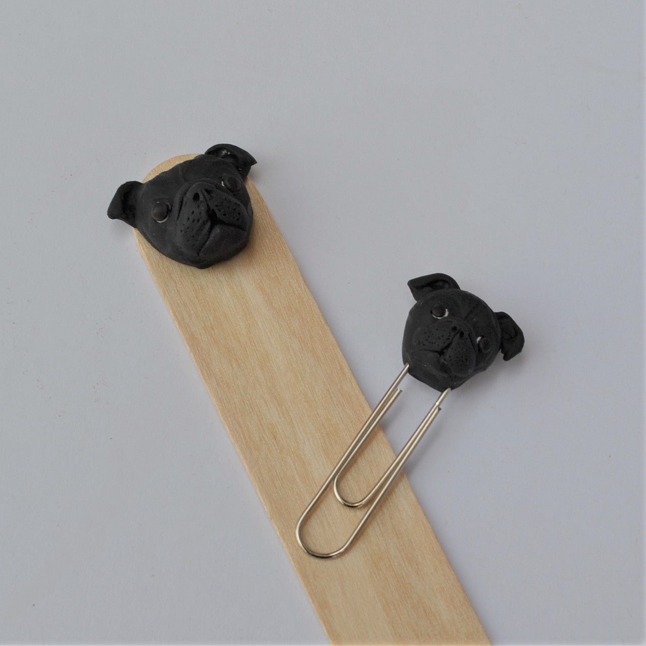 Handmade custom pet face page keeper showing a black pug's face.
