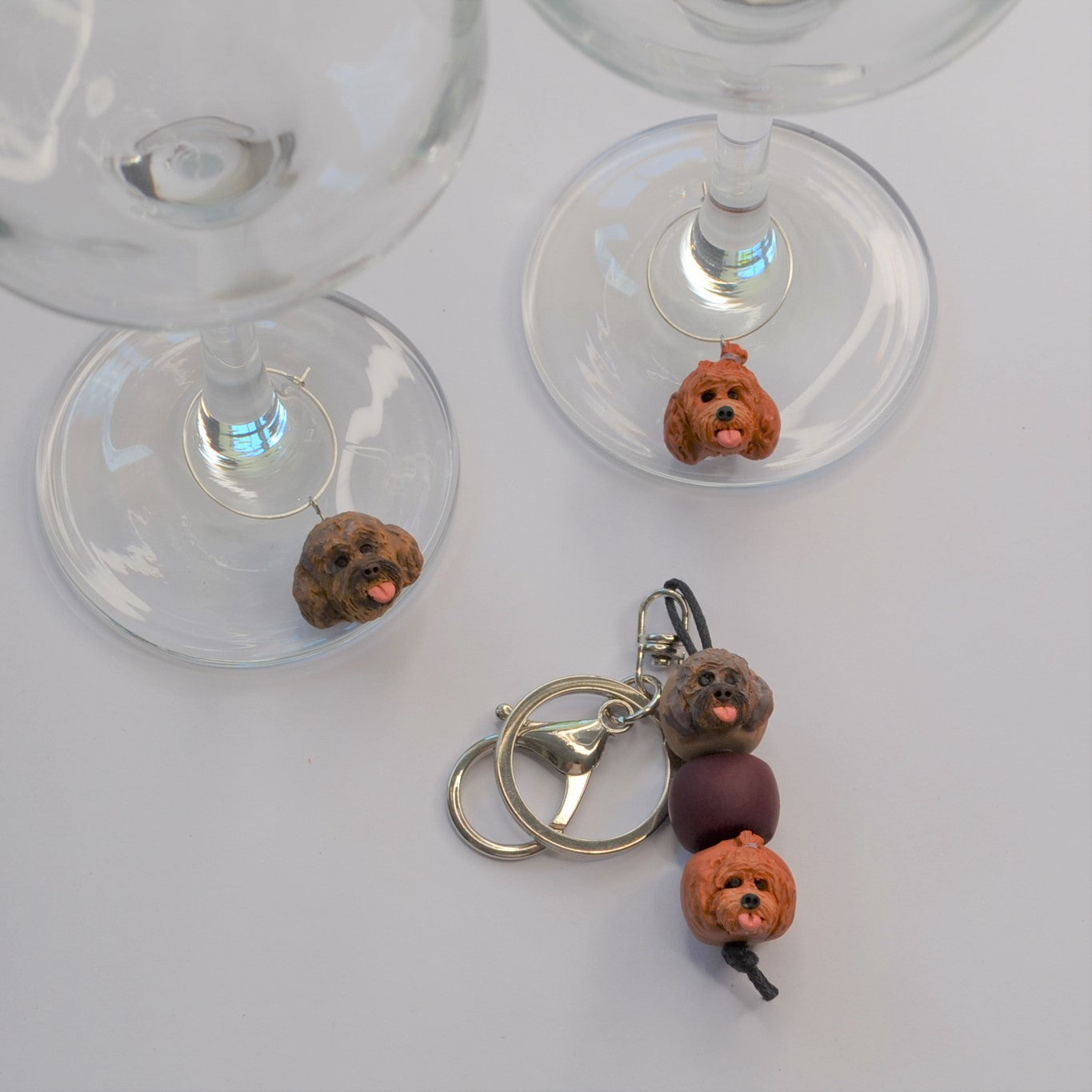 2 handmade wine glass charms of dogs with a matching keyring