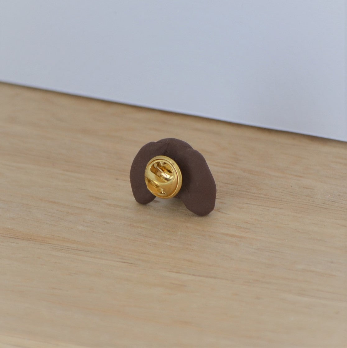 Back of handmade custom dog lapel pin.