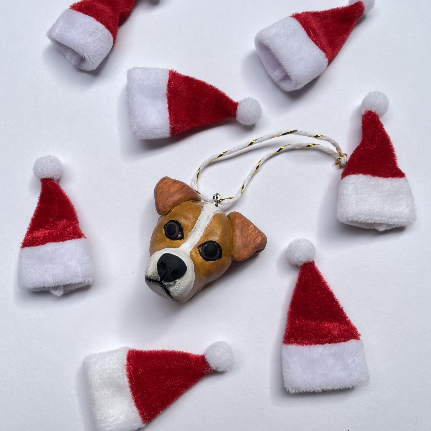 Handmade Christmas hanging ornament resembling the face of a Jack Russell.