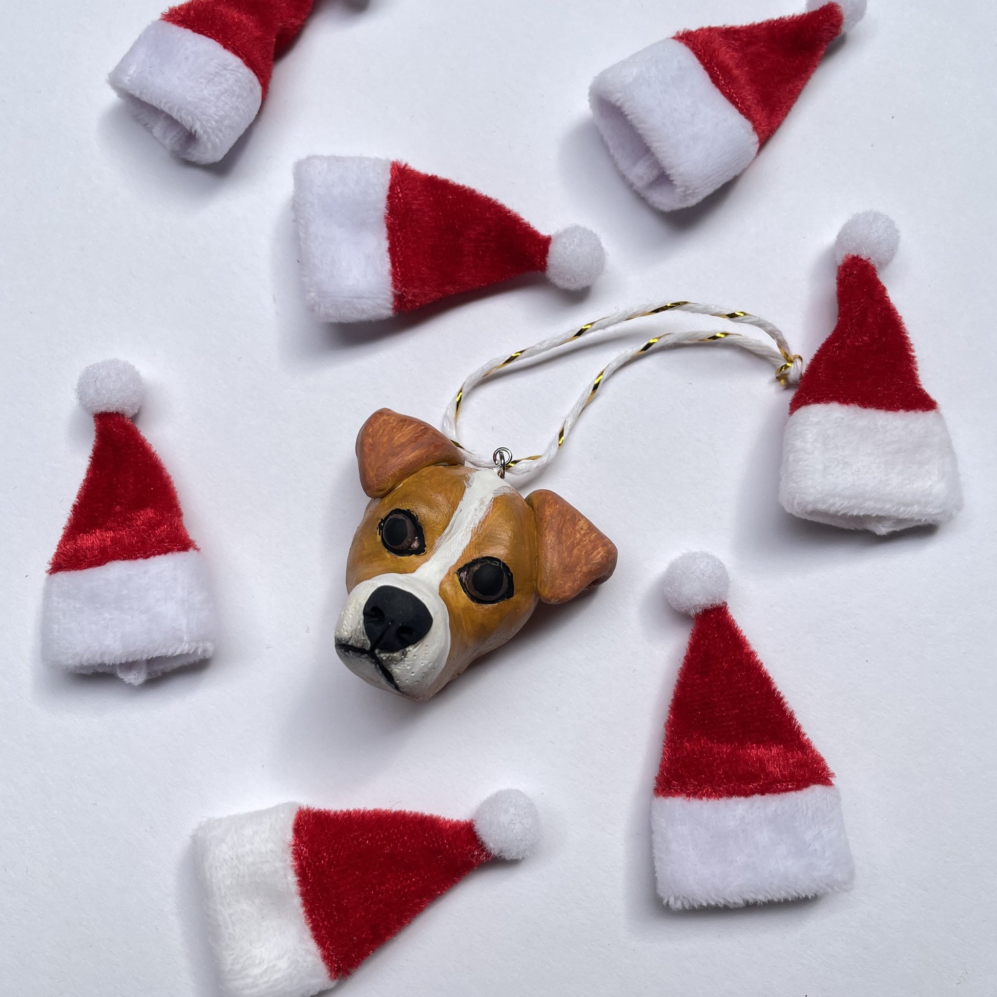 Handmade Christmas hanging ornament resembling the face of a Jack Russell.
