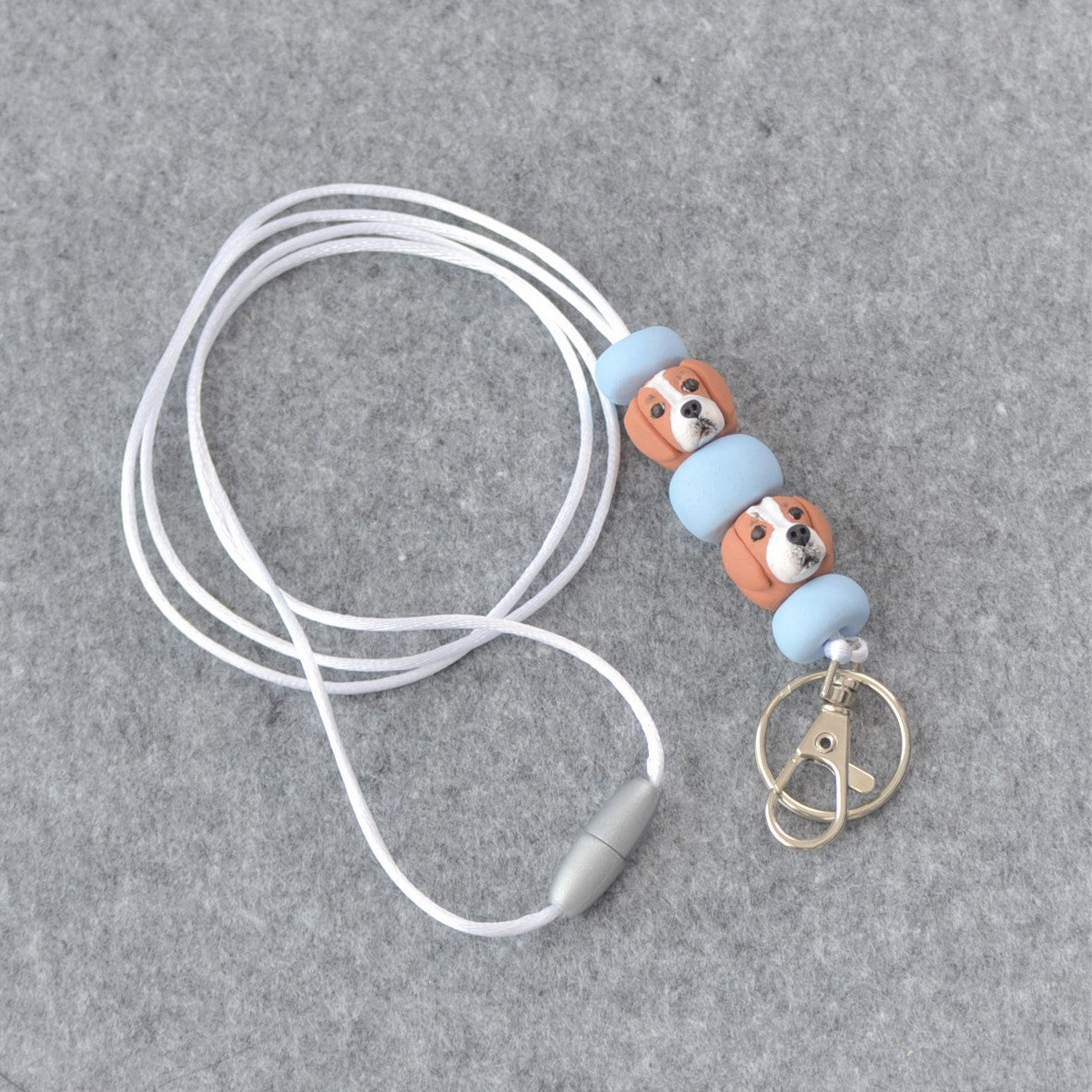 Custom dog handmade lanyard on grey felt background