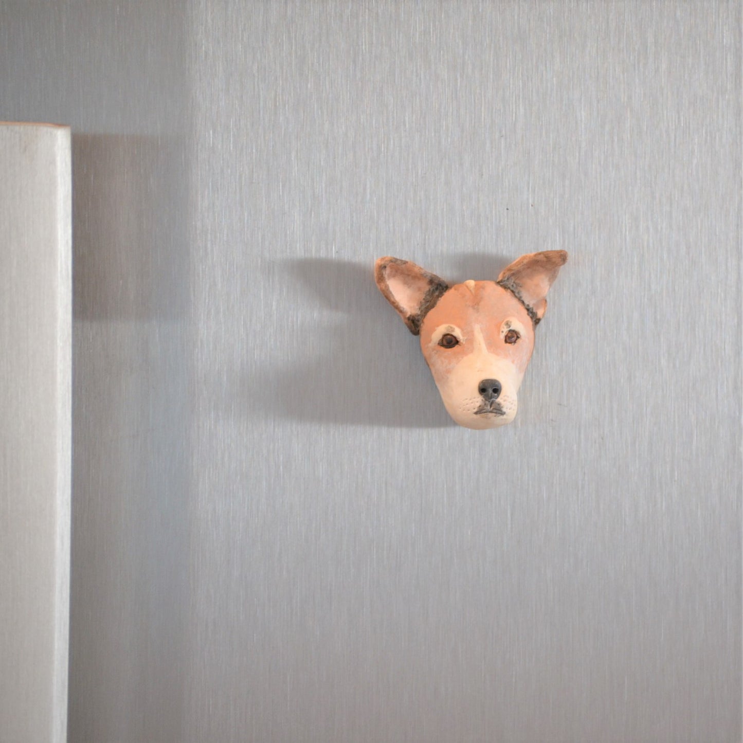 custom dog magnet displayed on fridge door