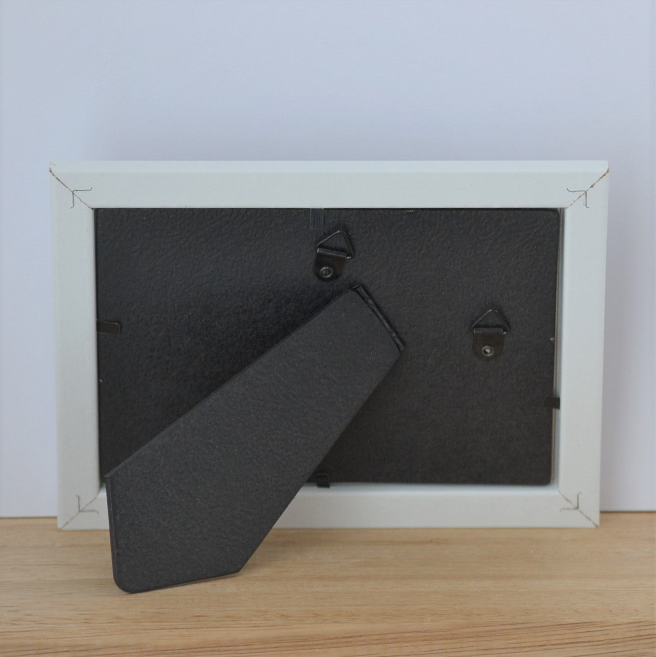 Back of white coloured pet memorial photo frame