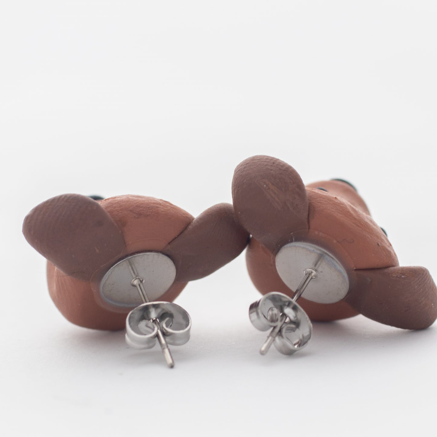 Handmade polymer clay Staffy stud earrings showing surgical steel backs