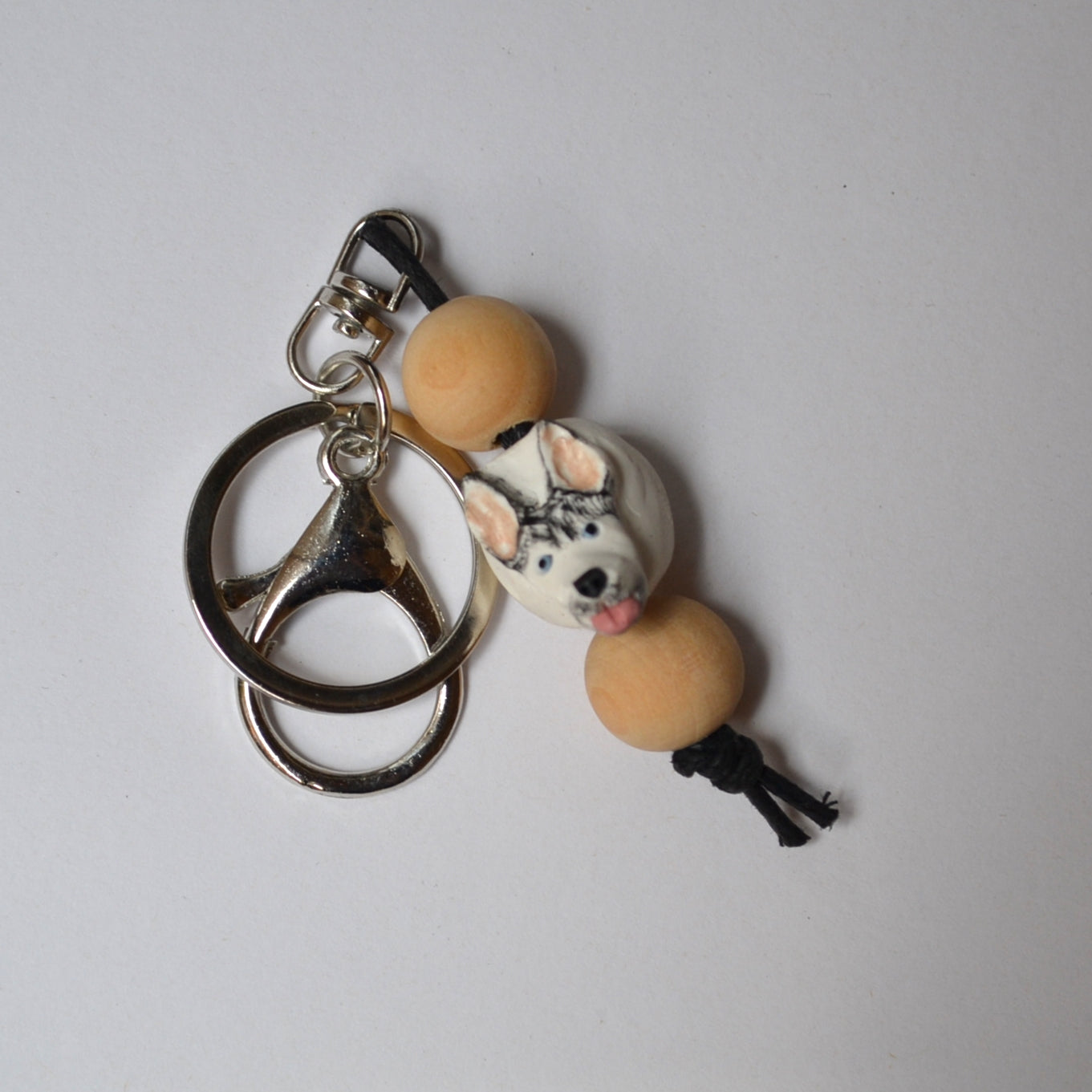 Handmade timber and polymer clay husky dog keychain on white background