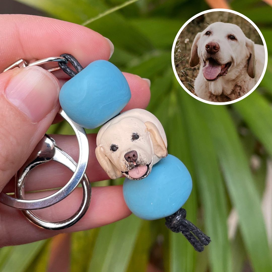 Handmade custom pet keyring with a golden retriever face and teal beads.