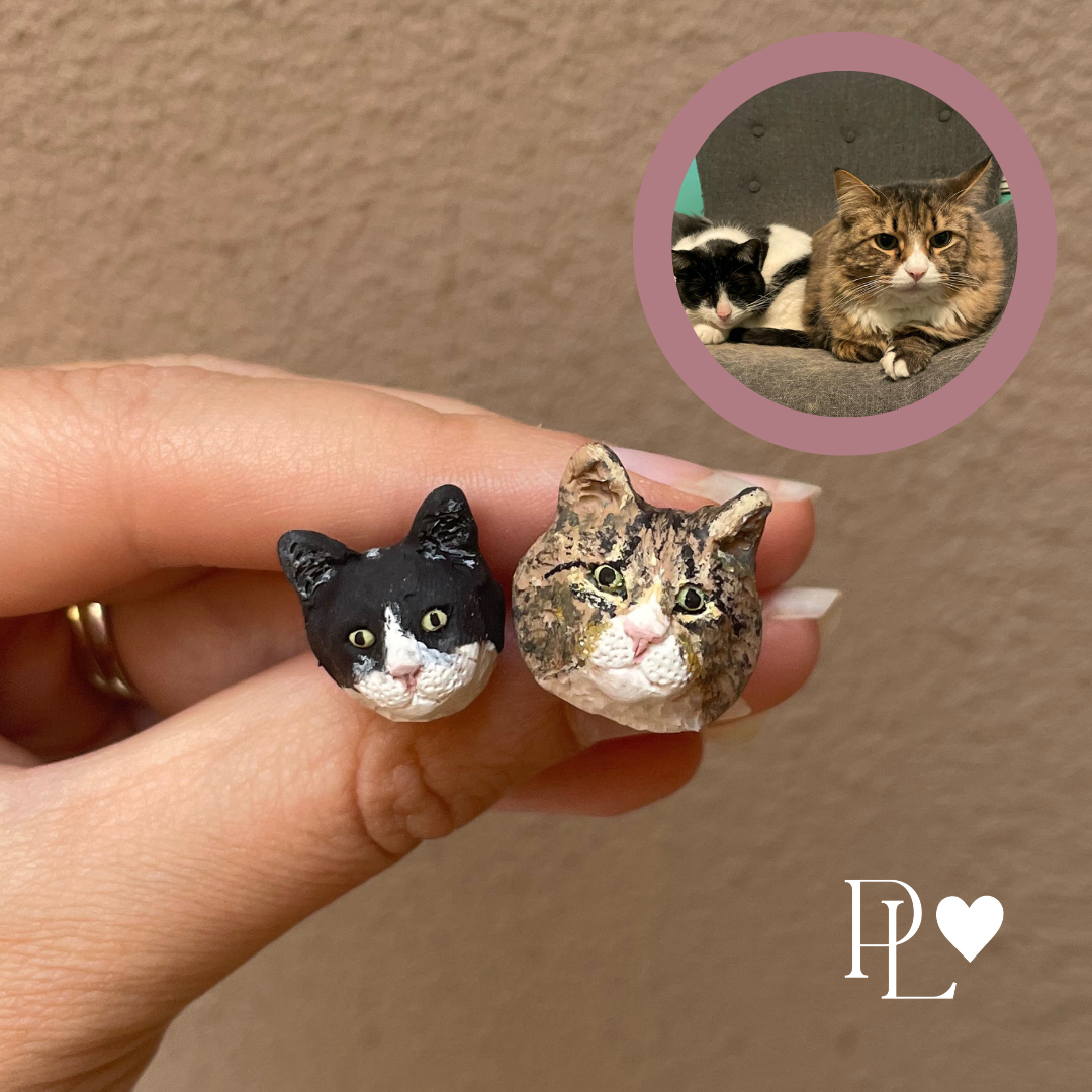 Handmade polymer clay custom pet earrings of 2 different cats.