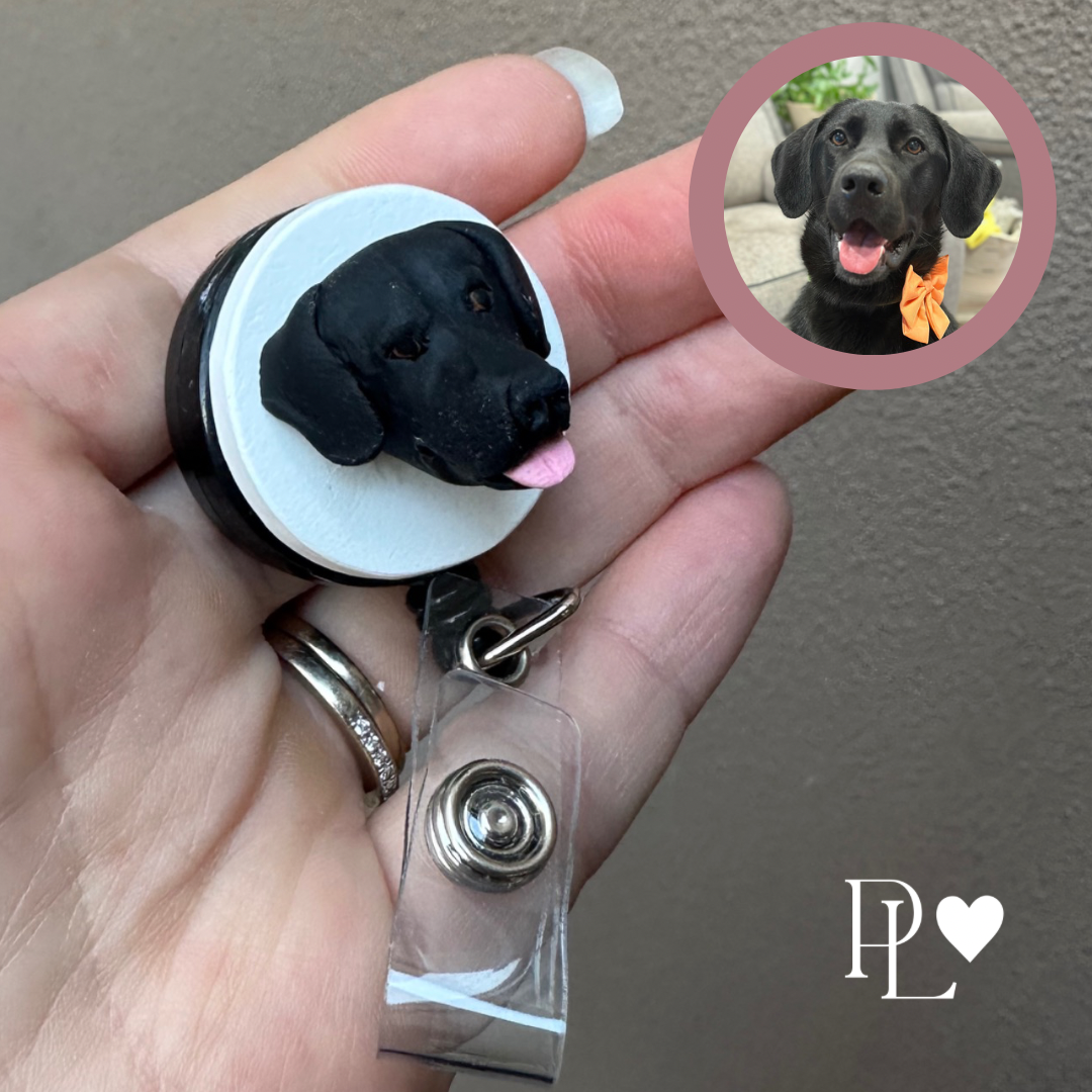 Handmade custom pet face badge reel showing a black labrador's face.
