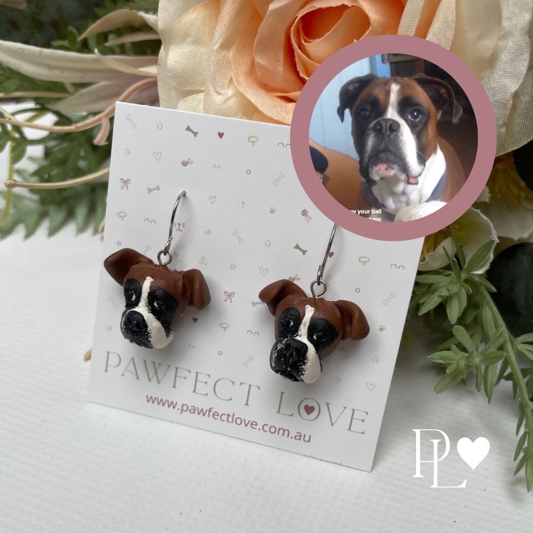 Handmade polymer clay dangle custom pet earrings of a boxer dog.