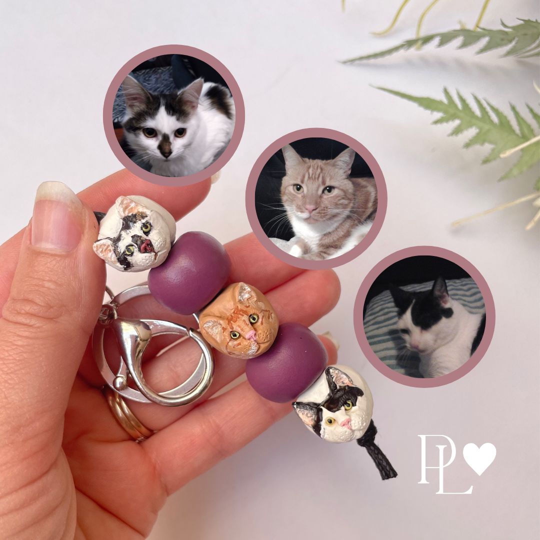 Handmade custom pet keyring with 3 individual cat face beads.