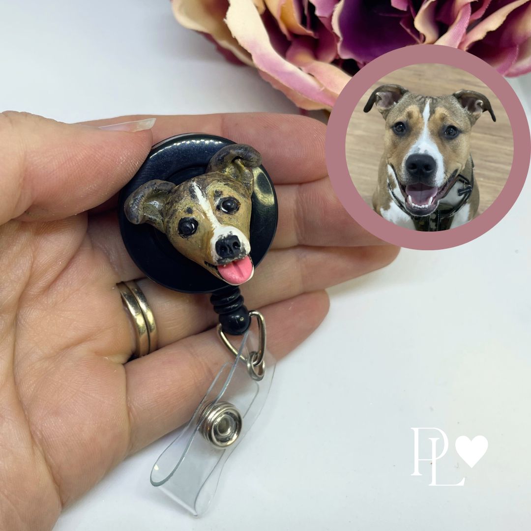 Handmade custom pet face badge reel showing a brown and white dog's face.