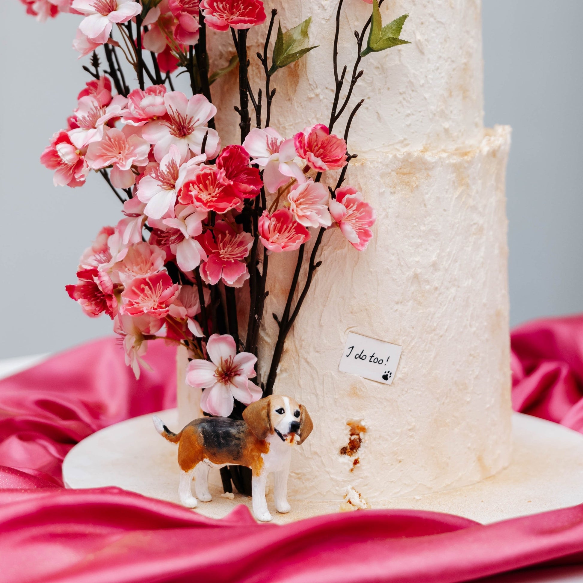 Custom beagle cake topper in a real wedding cake.