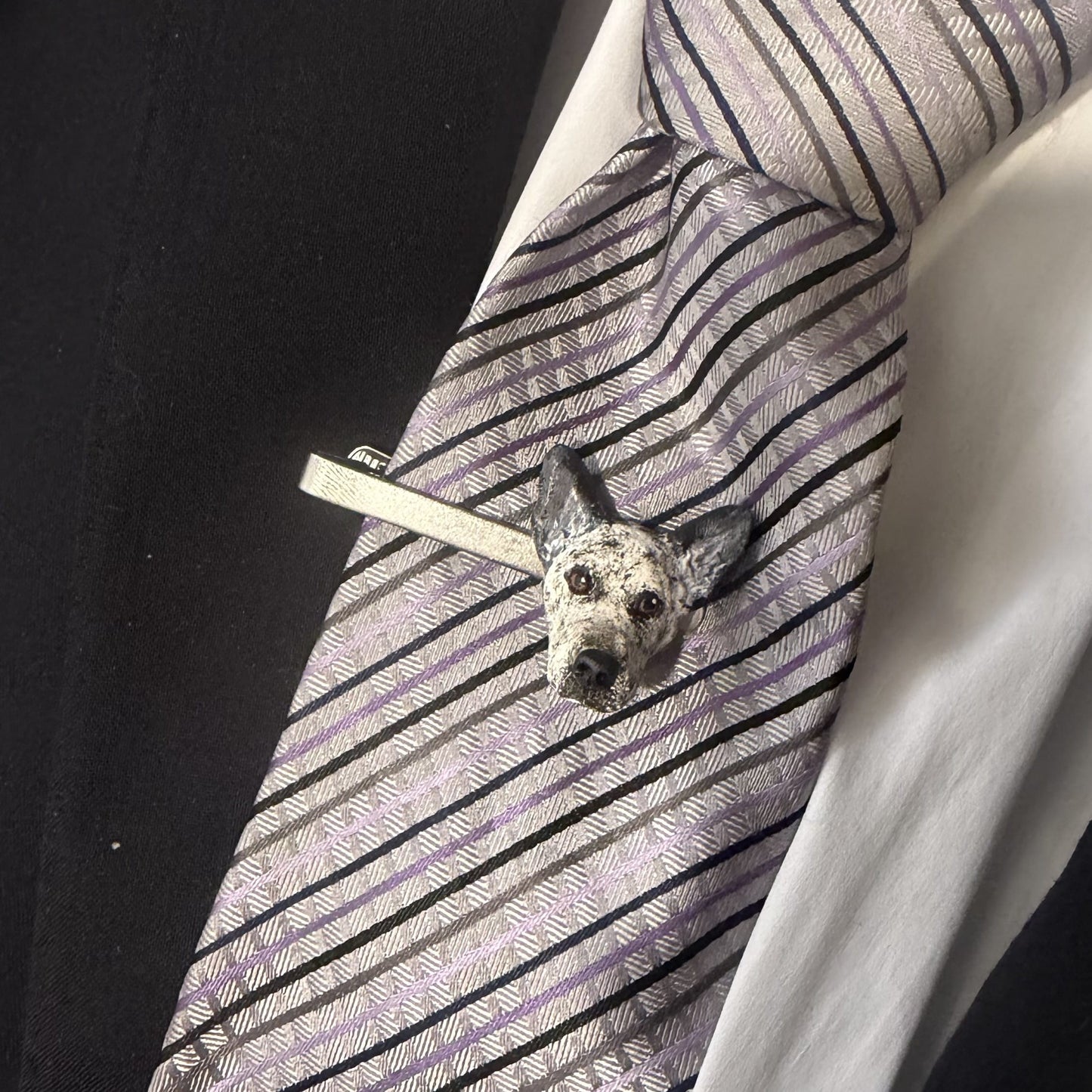 Blue heeler custom dog tie clip over a purple tie