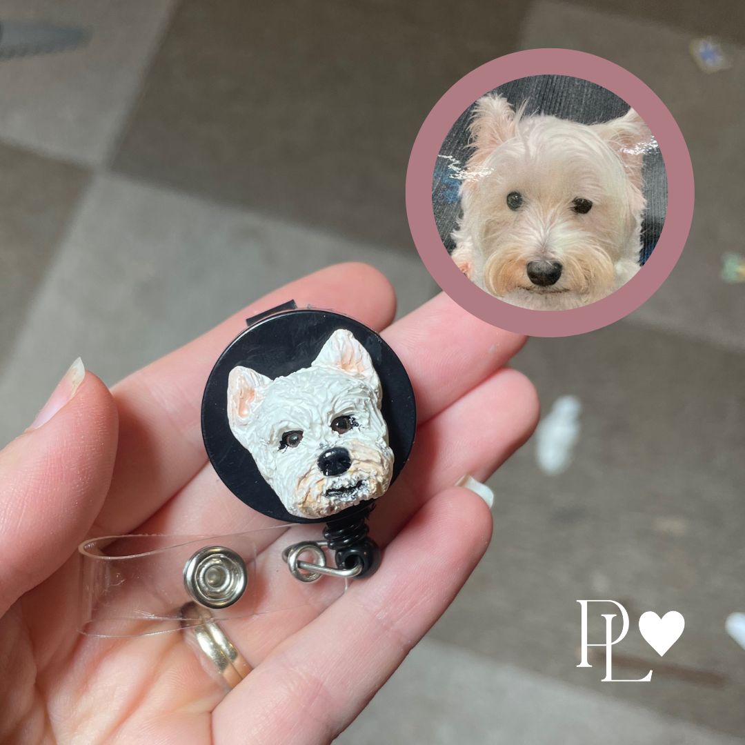 Handmade custom pet face badge reel showing a Westie dog's face.