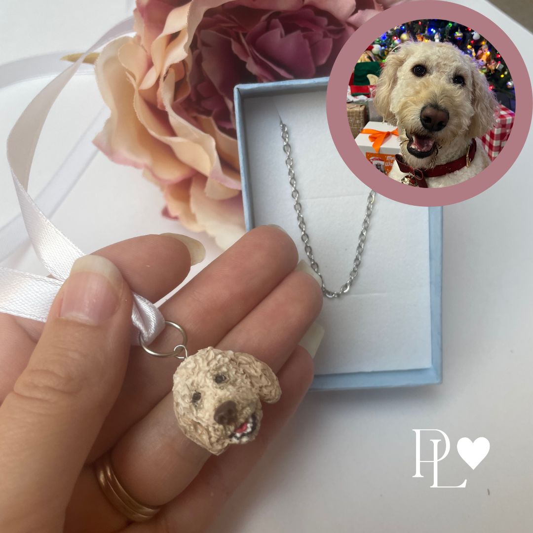 Custom pet bouquet charm of a golden lebradoodle, showing also a necklace chain.