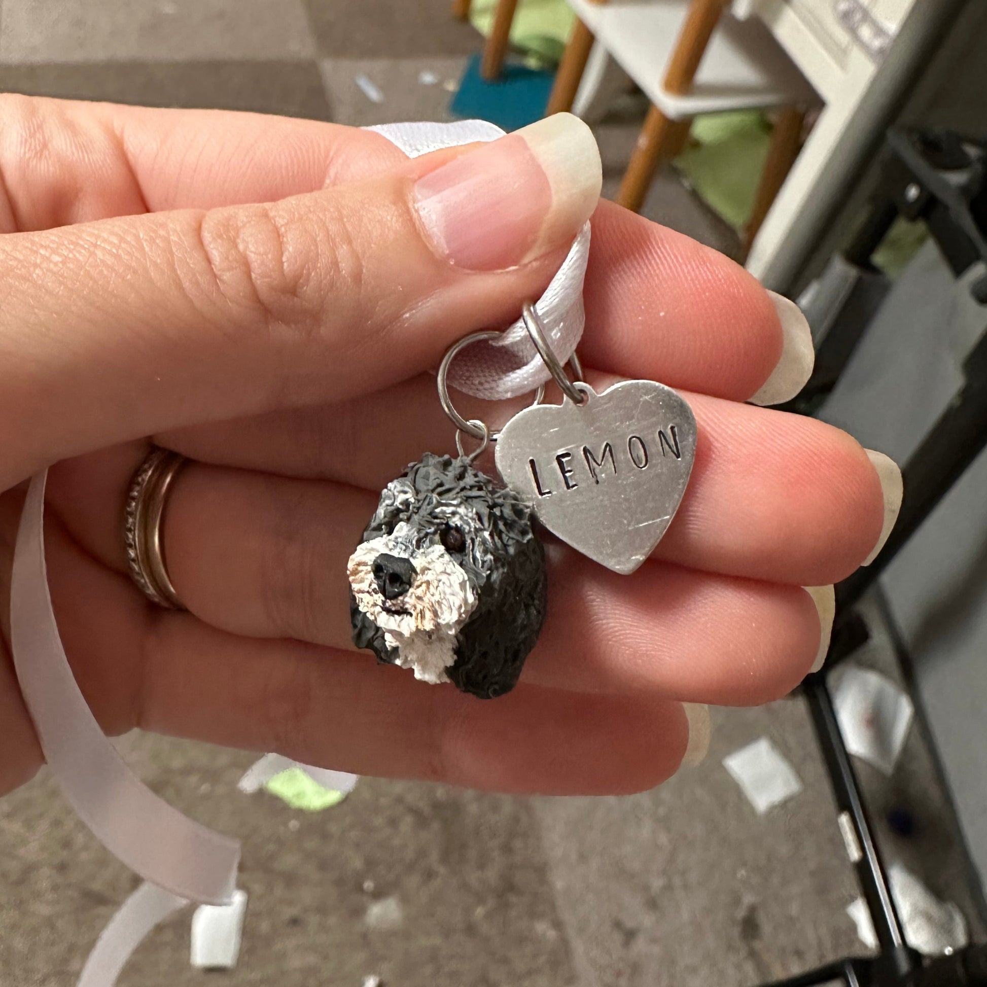 Custom dog memorial urn charm with heart stamped with the name Lemon.