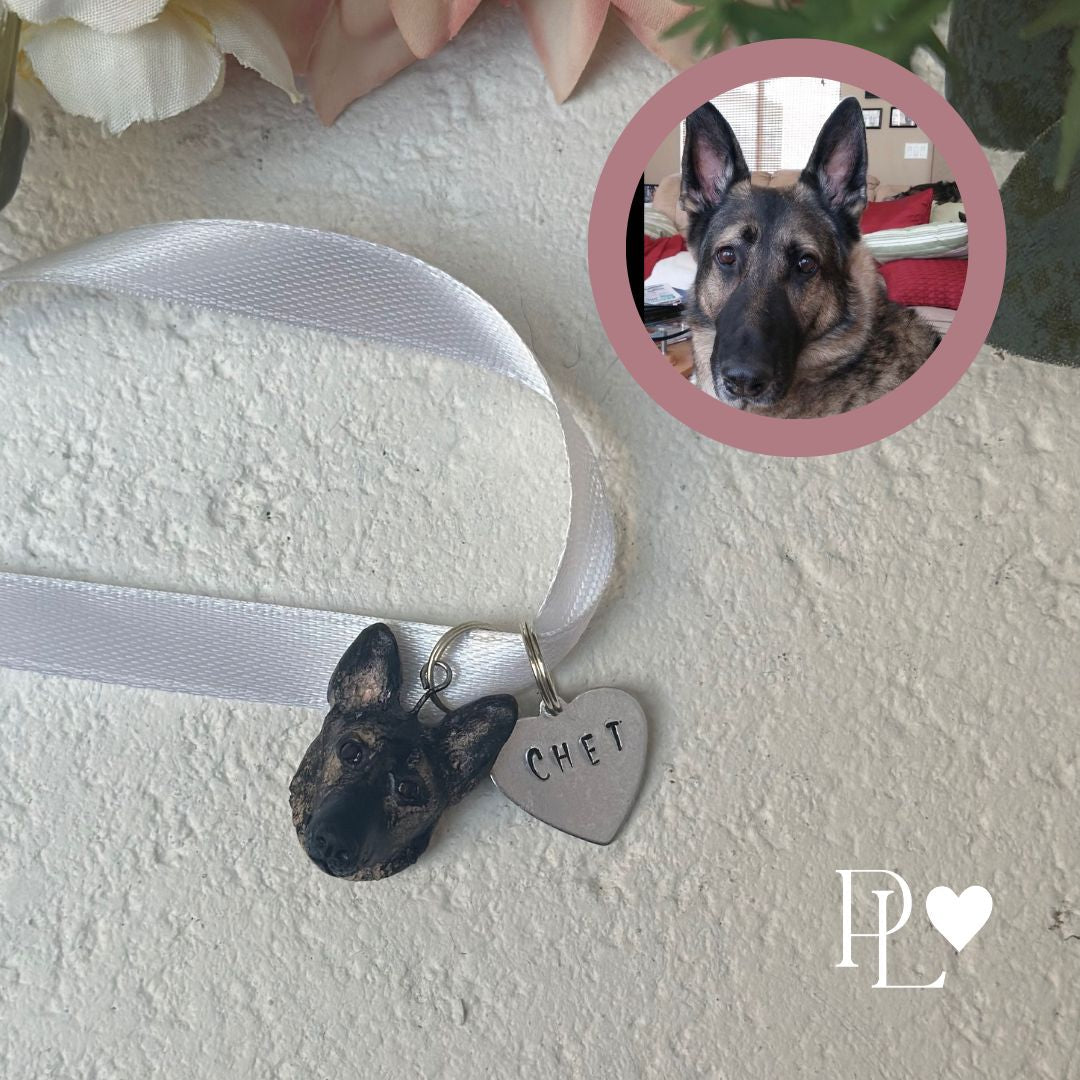Handmade German Shepherd hace charm with a metal stamped heart charm reading the name Chet.