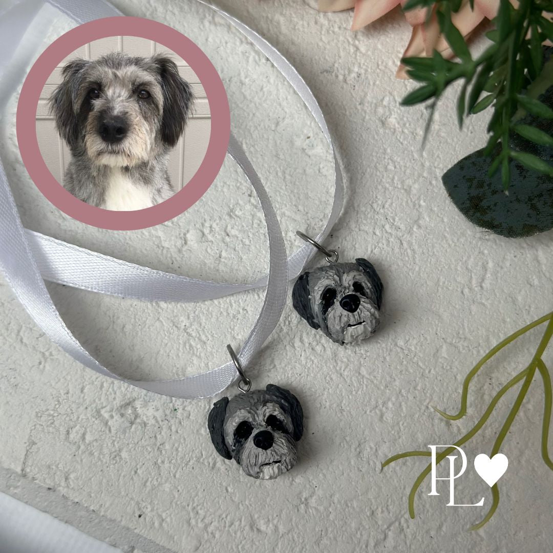 Two handmade urn charms of a grey dog.