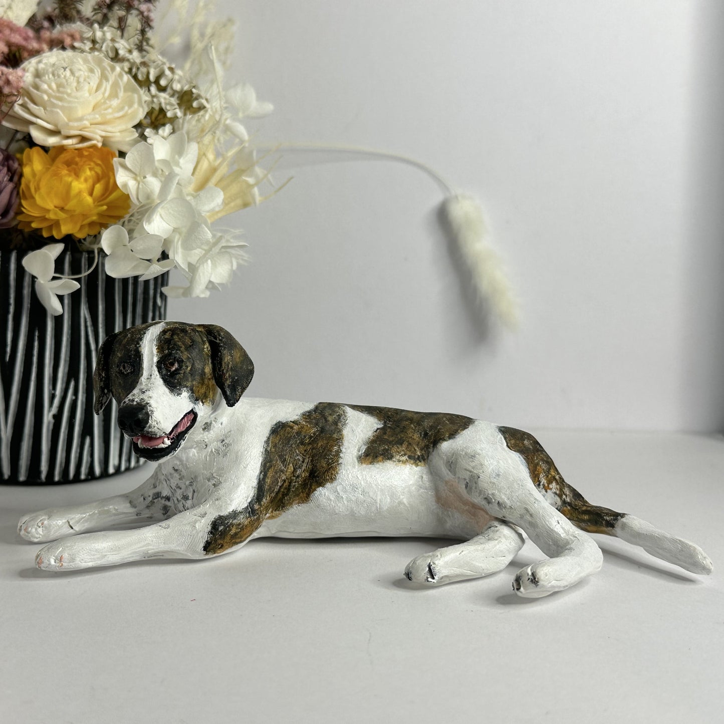 Custom laying dog handmade figurine.