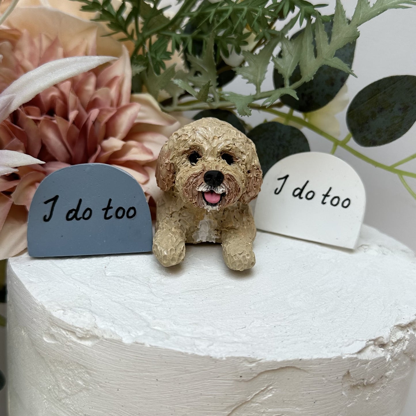 Handmade custom cavoodle peeking wedding cake topper, beside signs saying 'I do too'.