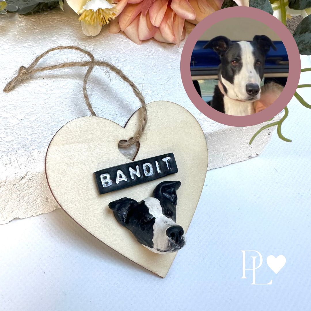 Heart shaped timber Christmas ornament with polymer clay handmade dog face and name.