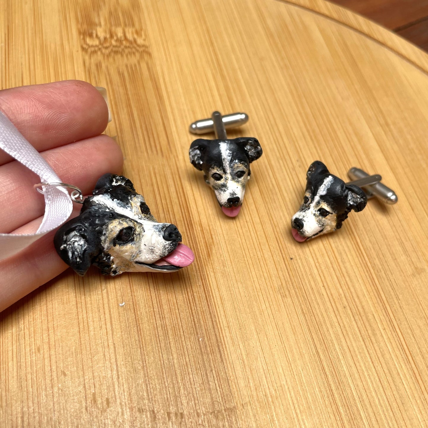 Bouquet dog pendant and cufflinks set on timber background