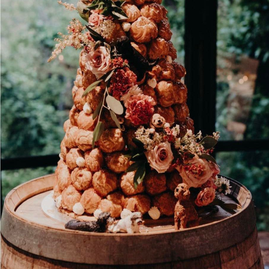 Croquembouche with 5 handmade dog wedding cake toppers.