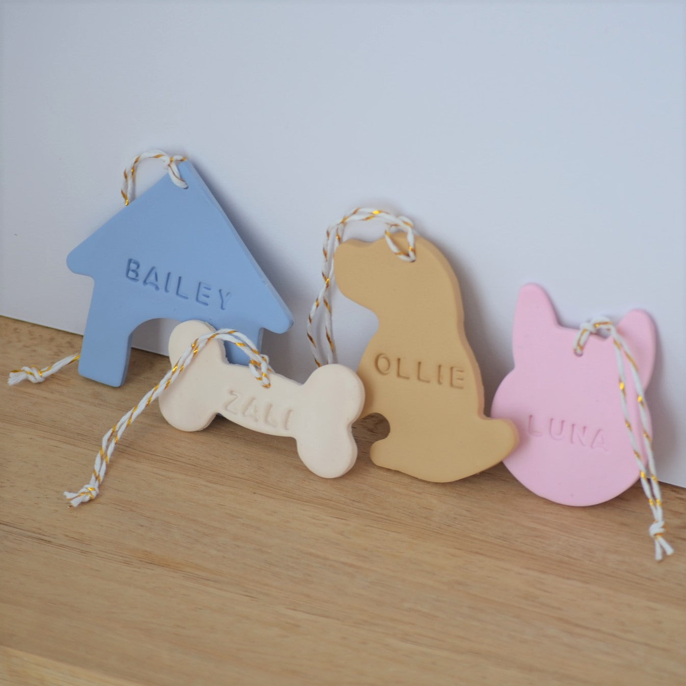 Group of 4 personalized pet name ornaments