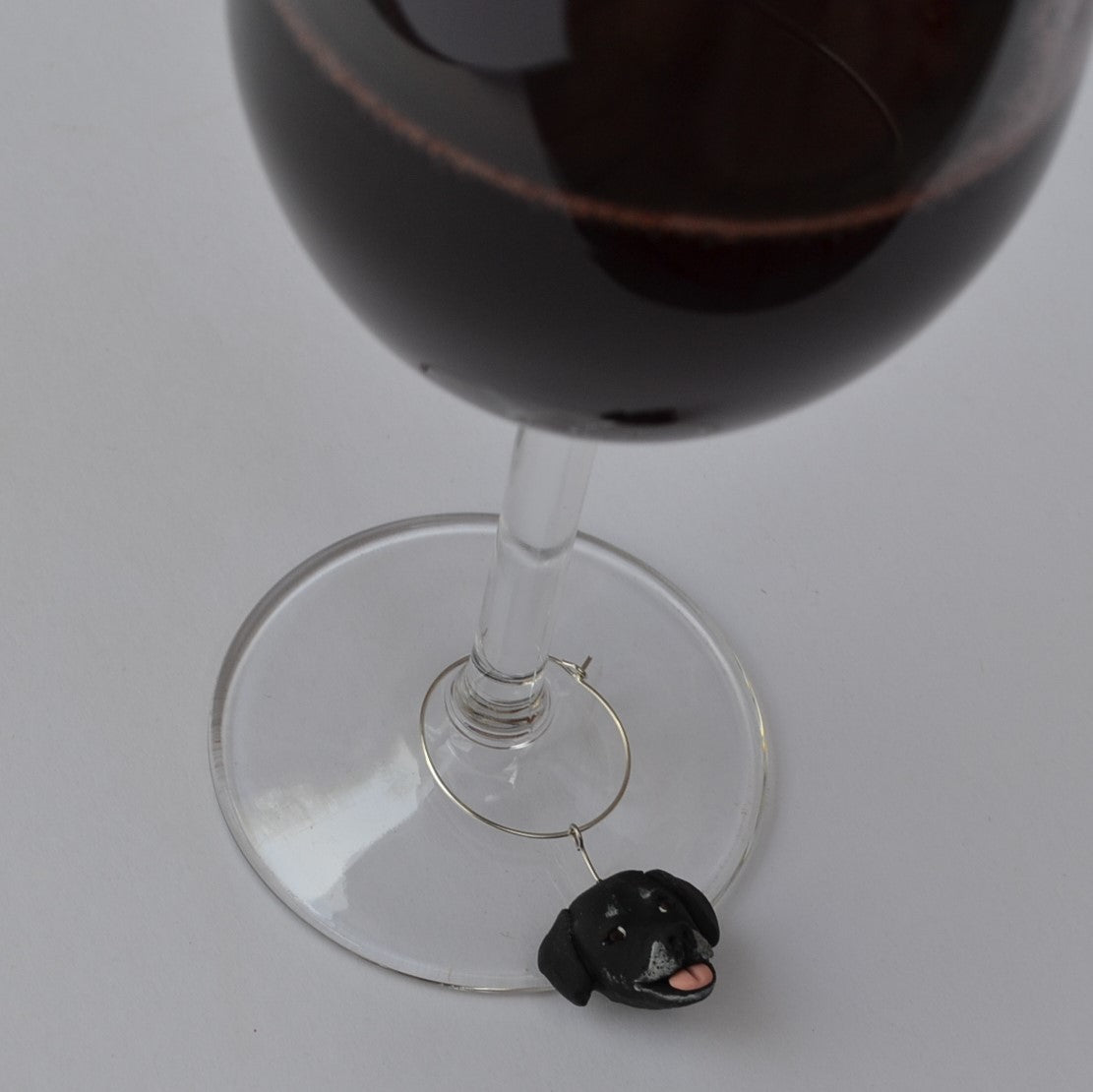 Handmade black labrador dog wine glass charm.