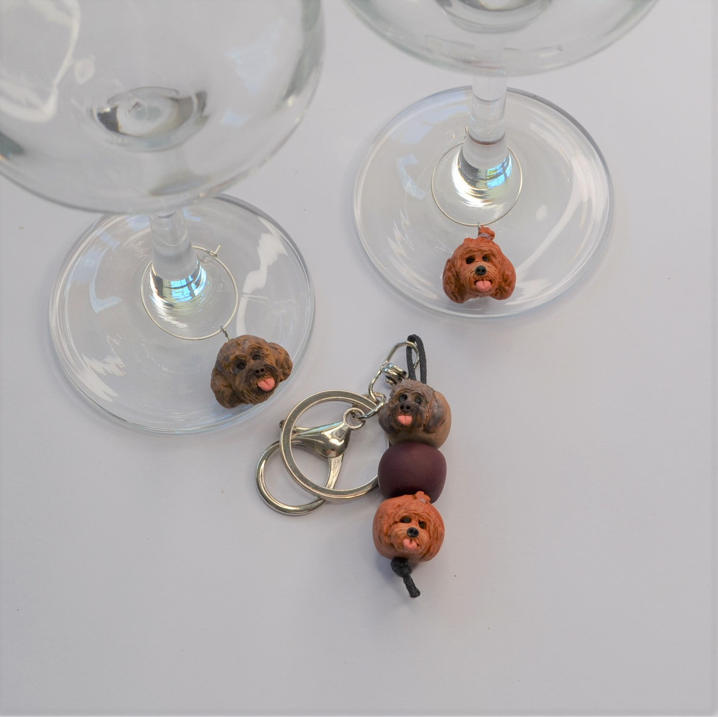 2 handmade wine glass charms of dogs with a matching keyring