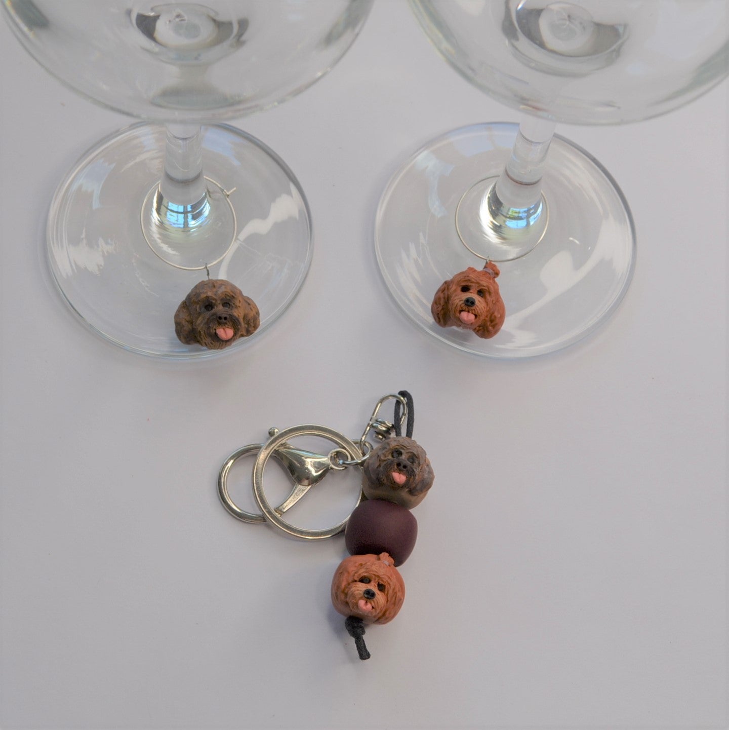 2 handmade wine glass charms of dogs with a matching keyring