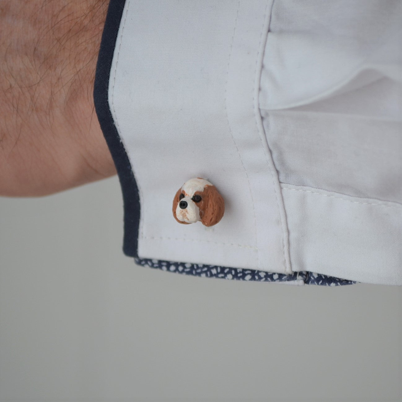 custom dog cufflink shown on sleeve