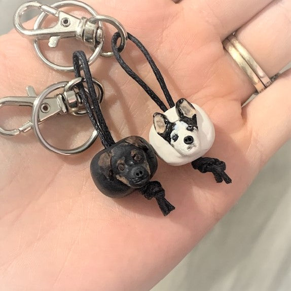 Handmade custom pet keyring with 2 individual dog face beads on separate keychains.