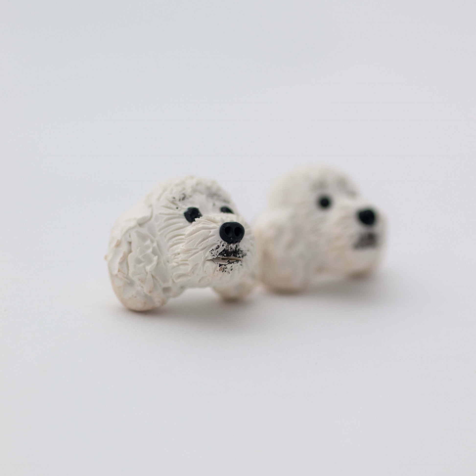 Handmade white poodle stud earrings by Pawfect Love, with white background