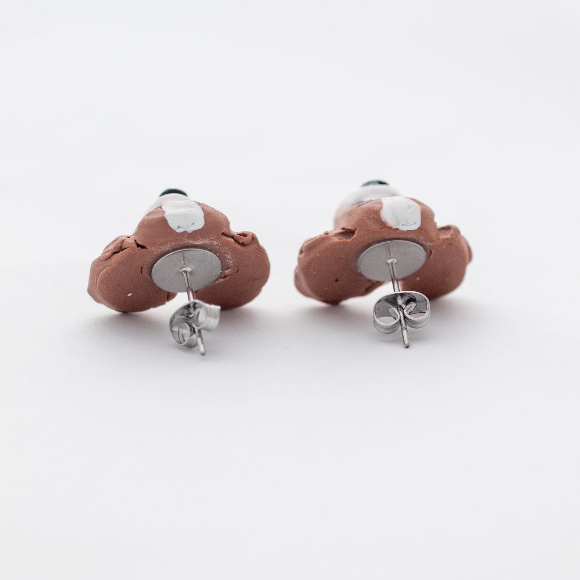 Handmade polymer clay cavalier king charles spaniel stud earrings surgical steel backs shown on white background
