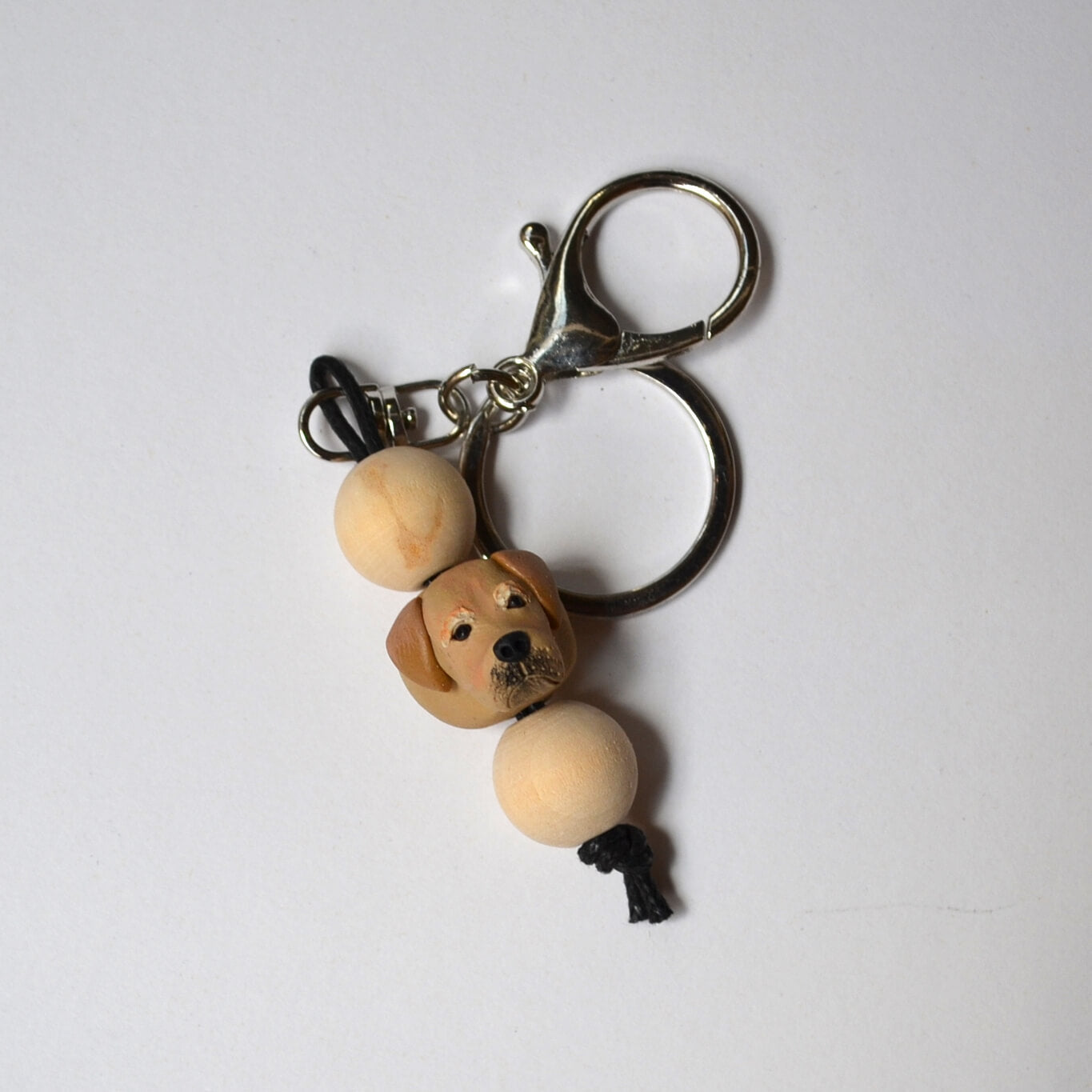 Handmade timber and polymer clay golden retriever dog keychain on white background