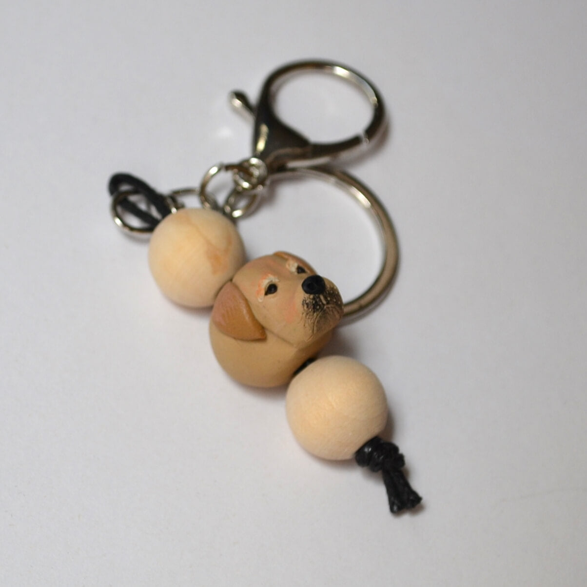 Handmade timber and polymer clay golden retriever dog keychain on white background