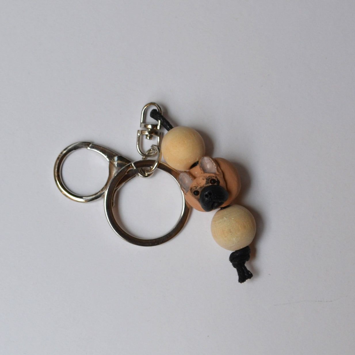Handmade timber and polymer clay french bulldog keychain on white background