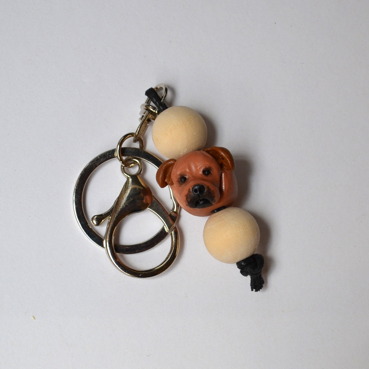 Handmade timber and polymer clay staffy dog keychain on white background