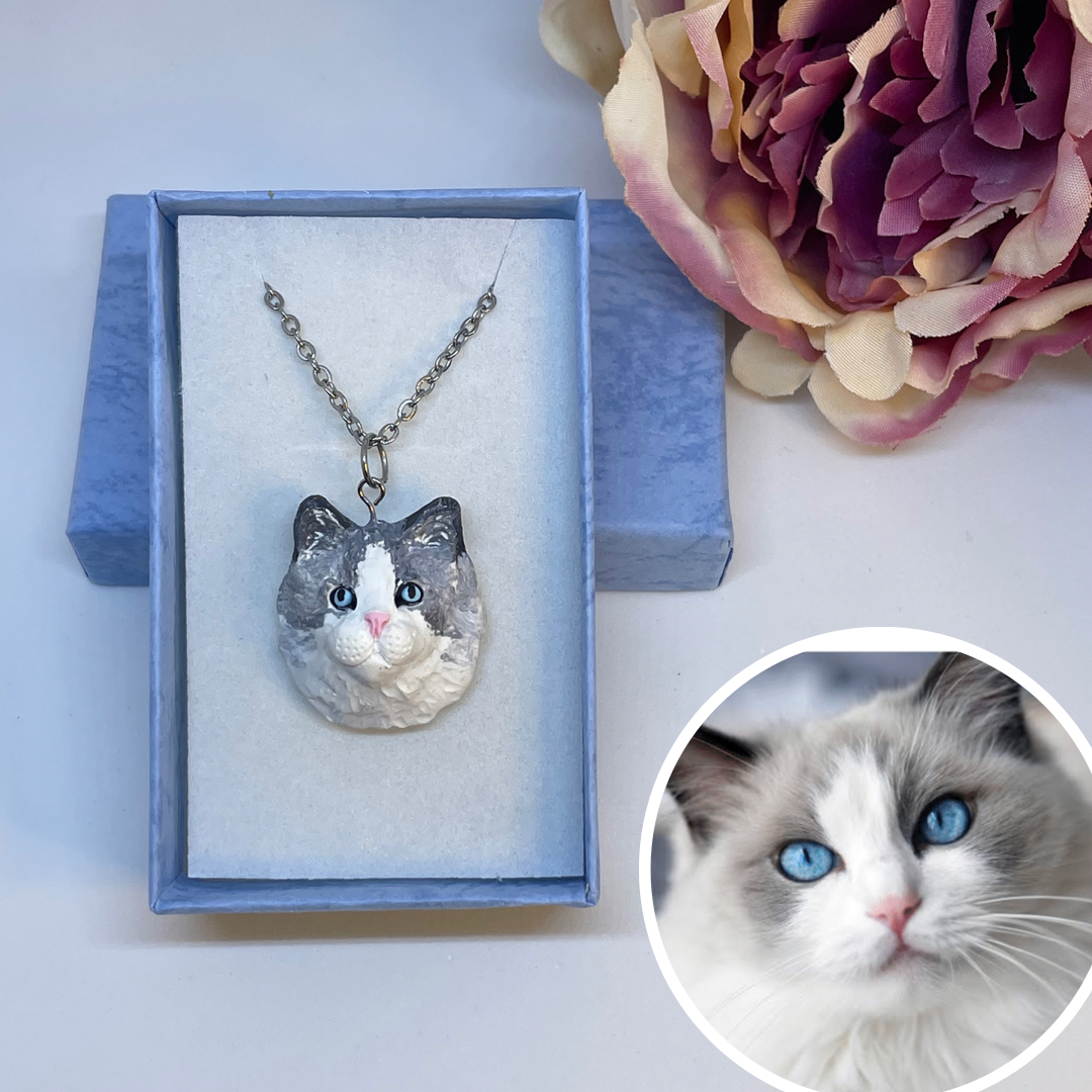 Handmade custom cat necklace pendant on chain, in blue display box.