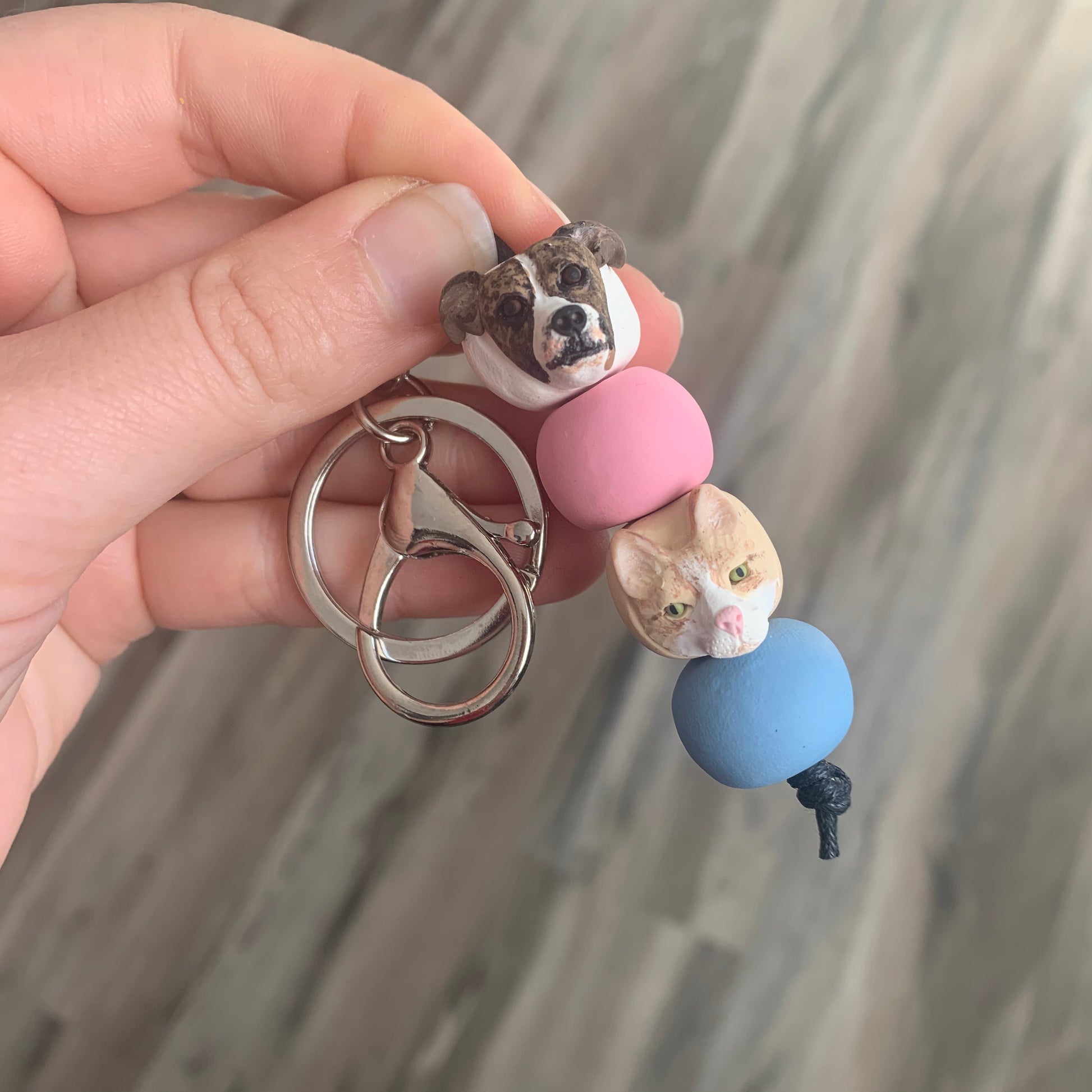 Handmade custom pet keyring with a dog and cat individual dog face beads.
