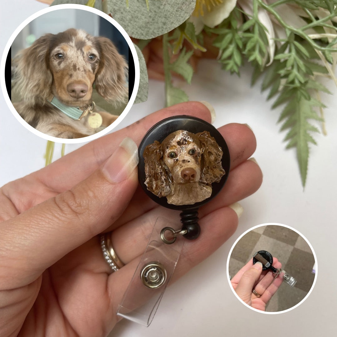 Handmade custom pet face badge reel showing a dachshund face.
