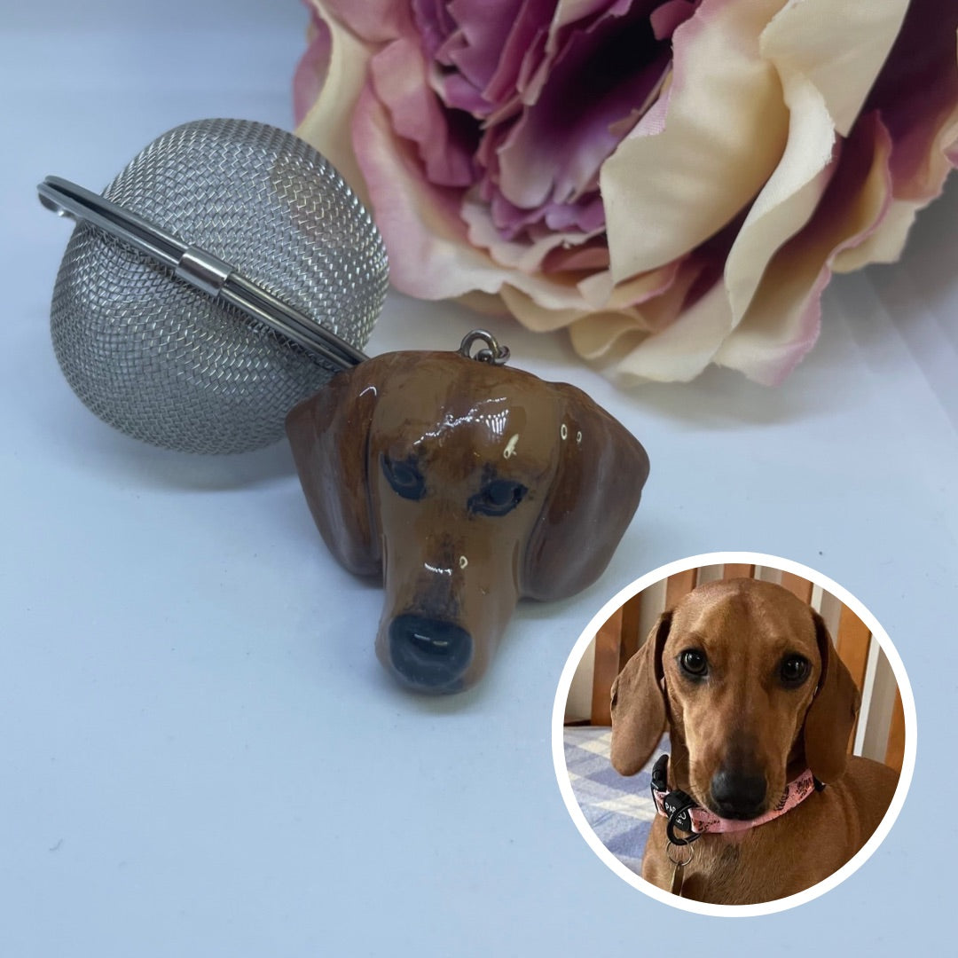 Handmade custom pet face mesh ball tea strainer showing a dachshund face.