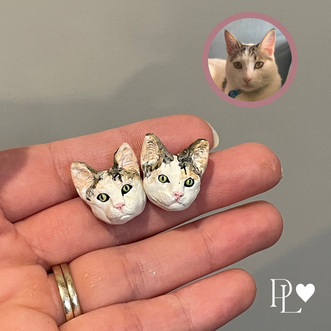 Handmade polymer clay custom pet earrings of a cat.