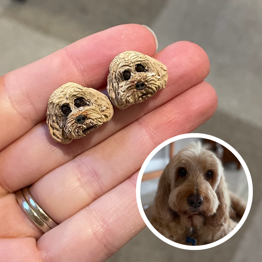 Handmade polymer clay custom pet stud earrings of a groodle dog.